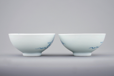 A pair of Chinese blue and white &quot;phoenix over the wall&quot; bowls, Yongzheng mark and poss. of the period