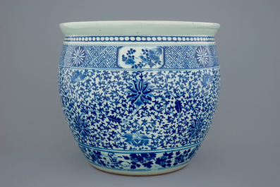 A Chinese blue and white lotus scroll fish bowl, 19th C.