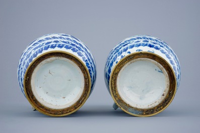 A pair of  Chinese blue and white gilt-bronze mounted jugs, Transitional period, 1620-1683