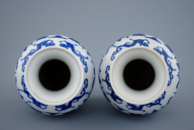 A pair of blue and white dragon vases with Wanli mark, 19th C.
