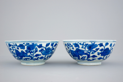 A pair of Chinese blue and white bowls with lions among peony scrolls, late Ming Dynasty
