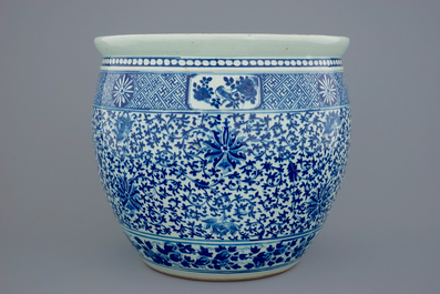 A Chinese blue and white lotus scroll fish bowl, 19th C.