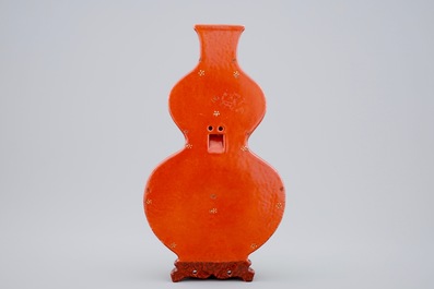 A Chinese coral-ground gilt-decorated famille-rose wall vase, Qianlong mark, 19/20th C.
