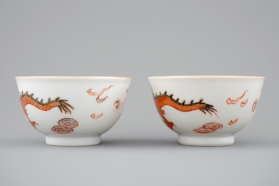 A pair of Chinese cups and saucers with dragons in iron red and gilt, Yongzheng, 1723-1735