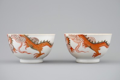 A pair of Chinese cups and saucers with dragons in iron red and gilt, Yongzheng, 1723-1735