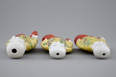 A set of three Chinese porcelain figures of kneeling boys, 19th C.
