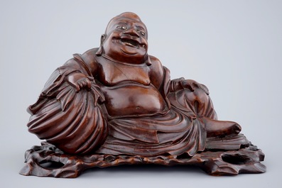 A large Chinese carved wood figure of Buddha on stand, 19th C.
