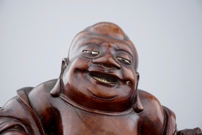 A large Chinese carved wood figure of Buddha on stand, 19th C.