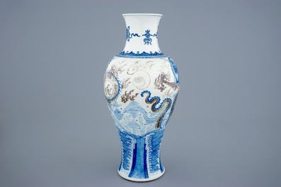 A Chinese baluster-shaped dragon vase in blue, white and underglaze red, Kangxi