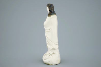 An unusual Chinese Dehua blanc de Chine figure of a black-scarved Luohan, 19th C.