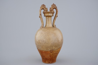 A Chinese stoneware amphora vase with dragon handles, Tang dynasty, 7th C.
