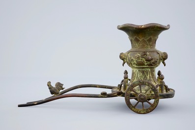 An unusual Chinese bronze vase on a chariot base, late Ming to Qing Dynasty