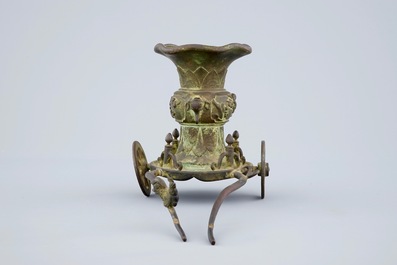 An unusual Chinese bronze vase on a chariot base, late Ming to Qing Dynasty