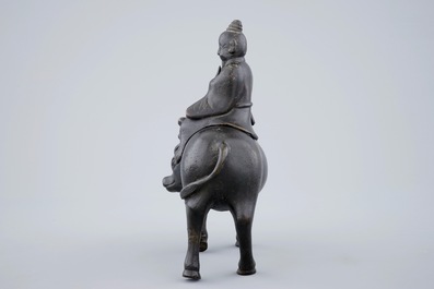 A Chinese bronze incense burner in the shape of a sage riding a buffalo, 19th C.