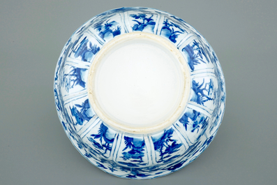 Un grand bol en porcelaine de Chine bleu et blanc moul&eacute; en forme de lotus, Kangxi