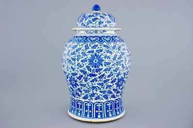 A Chinese blue and white vase and cover with lotus scrolls, 19th C.