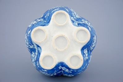 A Chinese blue and white tulip vase with prunus design, 19th C.