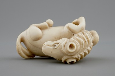 A signed Japanese ivory netsuke of a horse, 19th C.