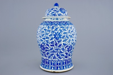 A Chinese blue and white vase and cover with lotus scrolls, 19th C.