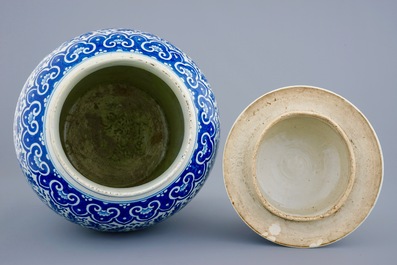 A Chinese blue and white vase and cover with lotus scrolls, 19th C.