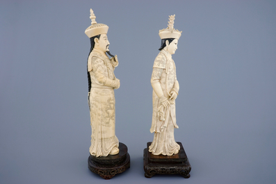A tall pair of Chinese carved ivory emperor figures, ca. 1900