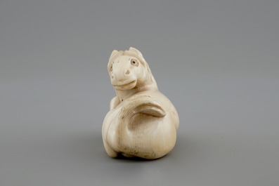 A signed Japanese ivory netsuke of a horse, 19th C.