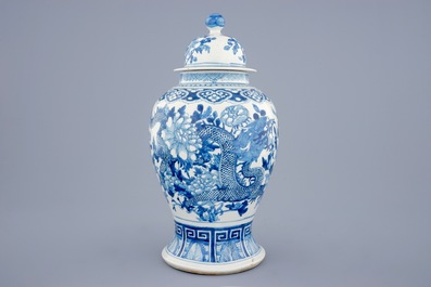 A Chinese blue and white vase and cover with dragons and peonies, 19th C.