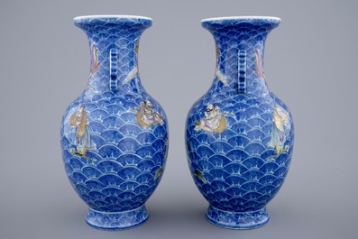 A pair of fine Chinese famille rose vases with immortals on waves, 19/20th C.