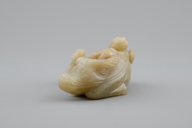 A Chinese jade group of a boy on a buffalo, 18/19th C.