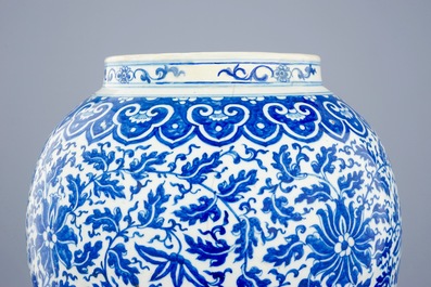 A Chinese blue and white vase and cover with lotus scrolls, 19th C.