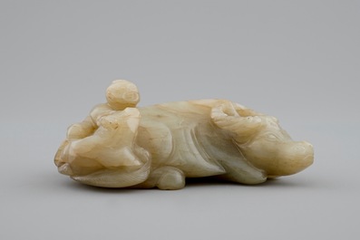 A Chinese jade group of a boy on a buffalo, 18/19th C.