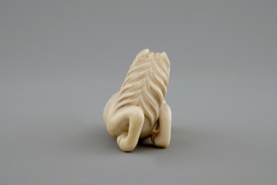 A signed Japanese ivory netsuke of a horse, 19th C.