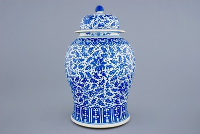 A Chinese blue and white vase and cover with lotus scrolls, 19th C.