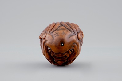 A Chinese carved walnut, signed, 20th C.