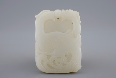A Chinese white jade pendant with dragons and phoenixes, 19/20th C.