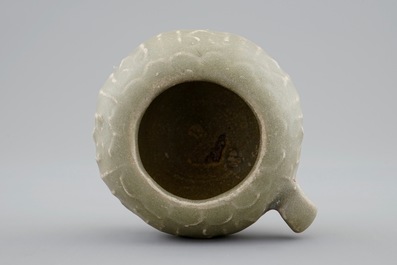 A Chinese celadon bird feeder, late Ming Dynasty