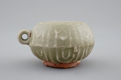 A Chinese celadon bird feeder, late Ming Dynasty