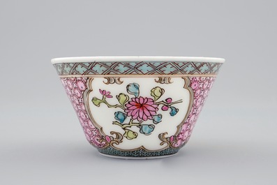 A Chinese famille rose eggshell cup and saucer with a cat near a flowervase, Yongzheng, 1723-1735