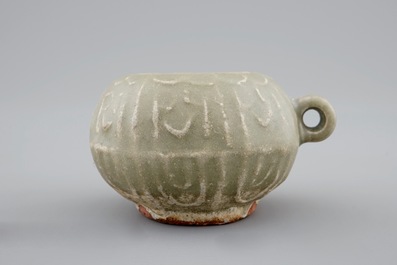 A Chinese celadon bird feeder, late Ming Dynasty