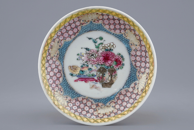 A Chinese famille rose eggshell cup and saucer with a central flowervase, Yongzheng, 1723-1735