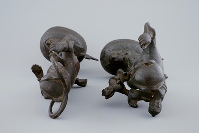 A pair of Chinese bronze mythological figures, Ming Dynasty