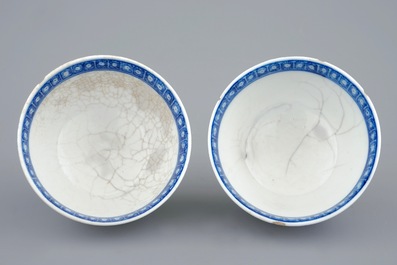 A pair of Chinese blue and white cups and saucers with &quot;The parrot on the perch&quot;, Qianlong, 18th C.