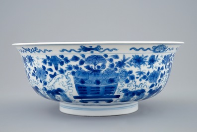 A Chinese blue and white dragon bowl with floral design, Kangxi