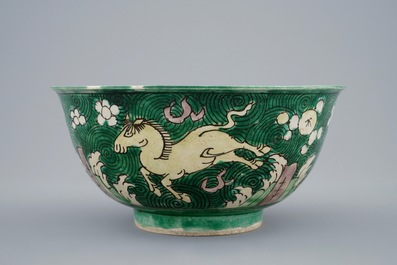 A Chinese famille verte biscuit bowl with horses, Kangxi