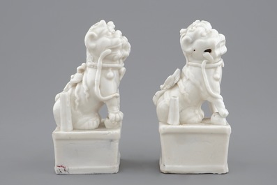 A pair of Chinese Dehua blanc de Chine buddhist lion joss stick holders, 18/19th C.