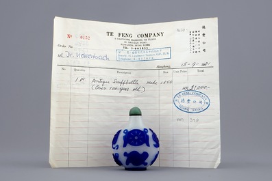 A Chinese blue and white overlay glass snuff bottle, 19th C.