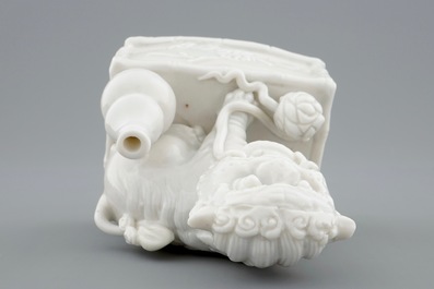 A Chinese Dehua blanc de Chine buddhist lion joss stick holder, 18/19th C.