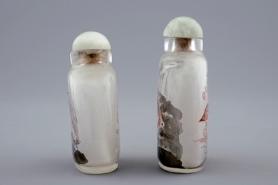 Two Chinese inside-painted glass snuff bottles with a cat and a tiger, 20th C.