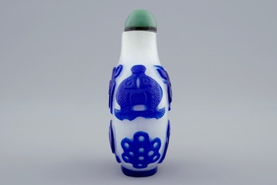 A Chinese blue and white overlay glass snuff bottle, 19th C.