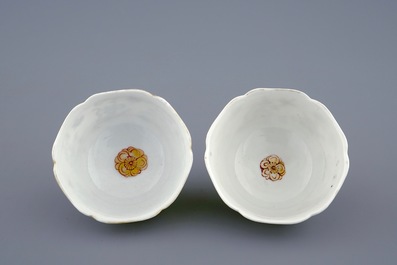 A pair of Chinese grisaille and gilt cups and saucers with insects among fruits and flowers, Yongzheng, 1723-1735